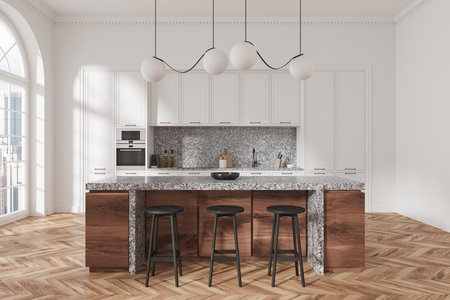 A contemporary kitchen with a marble island, wooden accents, and minimalist lighting. White cabinets and large windows complete the modern design concept. 3D Rendering.の写真素材