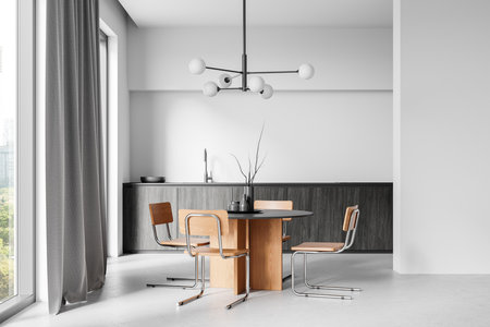 Minimalist dining room with round wooden table, metal chairs, modern chandelier, and gray cabinets. Large window with curtains. Contemporary home design. 3D Renderingの写真素材