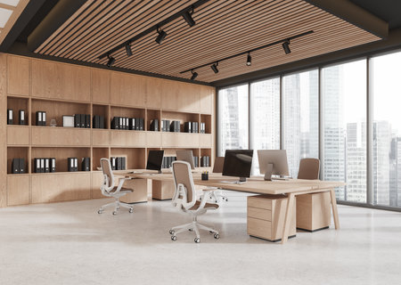 Elegant open workspace with wooden desks, ergonomic chairs, bookshelves, large windows, and natural light. Concept of modern office interiors. 3D Rendering.の写真素材