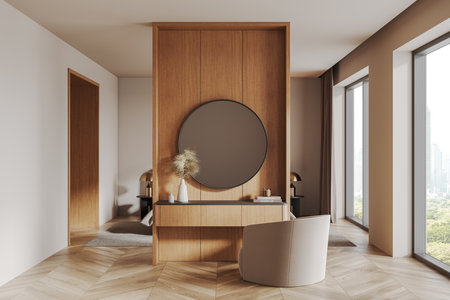 Contemporary room featuring a wooden panel with a round mirror, minimalist decor, and sunlight streaming through large windows. Concept of interior design. 3D Rendering.の写真素材