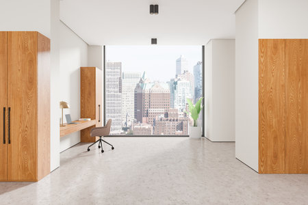 Bright office space with wooden furniture, a desk, a chair, and a large window with a cityscape view. Modern design, clean white walls, urban concept. 3D Rendering.の写真素材