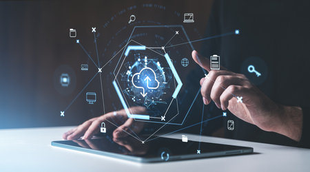 Hands using a tablet with a holographic interface showing cloud storage icons, futuristic graphic style, dark background, concept of online dataの写真素材