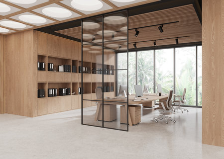 Contemporary open office space with natural wood furnishings, large windows, and a glass divider. Bright design with a nature-inspired concept. 3D Rendering.の写真素材