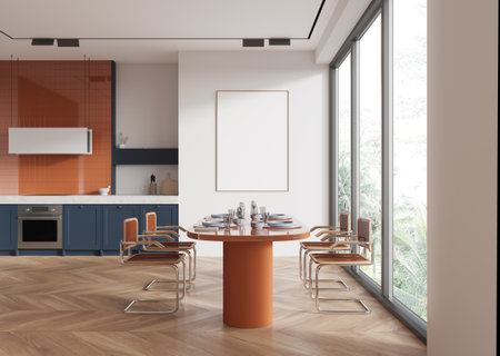 Dining area with orange table and chairs, wood flooring, blue kitchen cabinets, large windows, and a white wall. Concept of modern interior. 3D Rendering.の写真素材