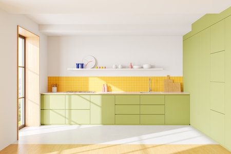 Contemporary kitchen with green cabinets, yellow tiled backsplash, white surfaces, and wooden flooring, showcasing a clean and vibrant design. 3D Rendering.の写真素材