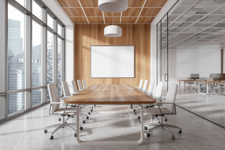 Spacious modern conference room with a large wooden table, white chairs, and a blank framed board on a wooden wall. Bright, professional setting. 3D Rendering.の写真素材