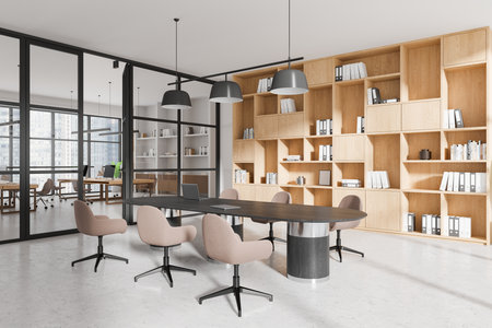 Elegant office interior featuring a modern table, chairs, wooden shelving, and glass partitions. Bright open space concept, contemporary design. 3D Rendering.の写真素材