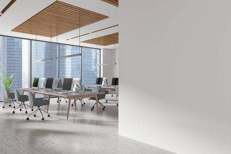 Contemporary office interior with blank wall, wooden ceiling accents, desks, chairs, and computers. City view through glass windows. Concept of coworking. 3D Rendering.の写真素材