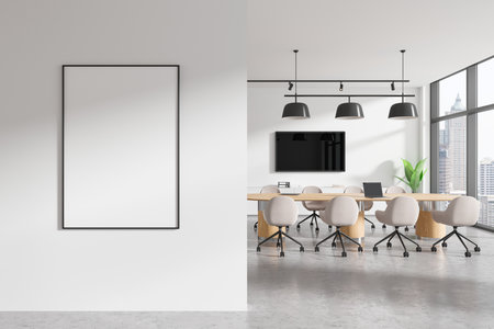 Modern meeting room with a blank vertical frame, light decor, stylish chairs around a wooden table, and a city view through large windows. Concept of office interior. 3D Rendering.の写真素材