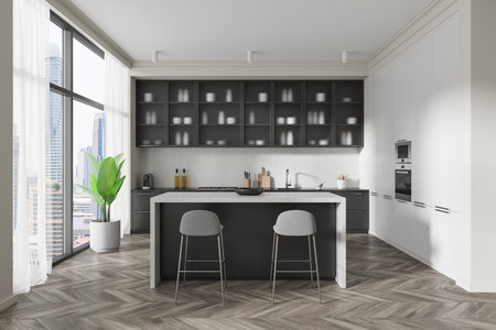 Stylish modern kitchen with white and dark cabinets, large windows, herringbone flooring, and a functional central island. Clean household decor. 3D Rendering.の写真素材