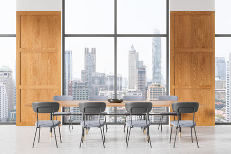 Contemporary meeting room interior featuring a wooden table, gray chairs, large windows with a cityscape view, minimalist design, concept of modern workspace. 3D Rendering.の写真素材