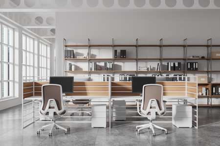 Open workspace with modern furniture, shelves with binders and decor, natural light from large windows, minimalistic interior, coworking concept. 3D Rendering.の写真素材