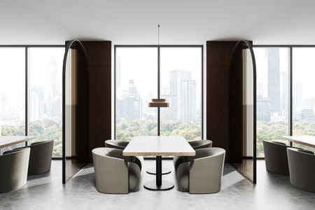 Contemporary dining space with cozy round chairs around tables, neutral tones, large windows with cityscape and greenery view. Concept of elegance. 3D Rendering.の写真素材