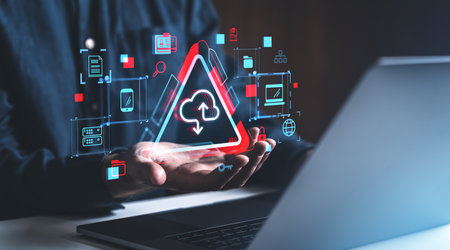 Hands presenting a glowing cloud icon surrounded by digital symbols and data, with a blurred background, symbolizing cloud storage servicesの写真素材
