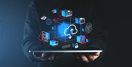 Cloud storage icons with security warnings displayed on a tablet held by hands, holographic style, dark background, concept of online data securityの写真素材