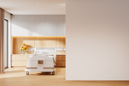 Hospital room featuring a white bed, wooden cabinets, and a blank wall. Minimalist interior design with natural lighting and cozy elements. Concept of healthcare and mockup space. 3D Rendering.の写真素材
