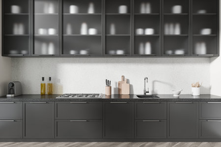Stylish modern kitchen featuring dark cabinets, a minimalist countertop, light wall background, and elegant decor elements. Clean luxury design. 3D Rendering.の写真素材