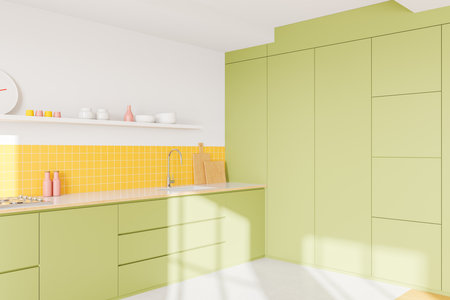 Contemporary kitchen featuring green cabinets, yellow tiled backsplash, open shelf with decor, and countertop in bright lighting. Concept of modern design. 3D Rendering.の写真素材