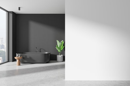 Modern bathroom with a dark bathtub, wooden stool, green plant, and vertical panel wall, next to a blank white wall. Minimalist interior concept. 3D Rendering.の写真素材
