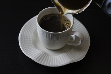 Coffee filling in cupの写真素材