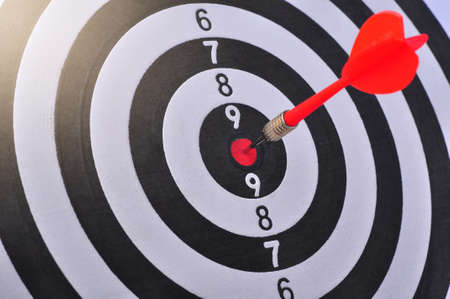 Bullseye is a target of business. Dart is an opportunity and Dartboard is the target and goal. So both of that represent a challenge in business marketing as concept.の写真素材