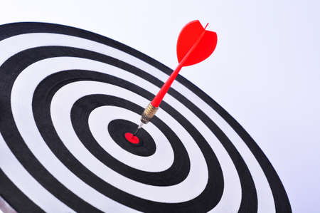 Bullseye is a target of business. Dart is an opportunity and Dartboard is the target and goal. So both of that represent a challenge in business marketing as concept.の写真素材