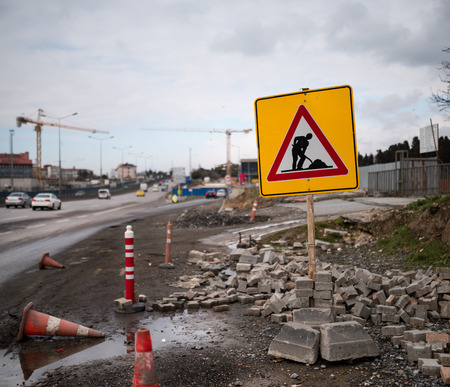 Road construction work and signboard