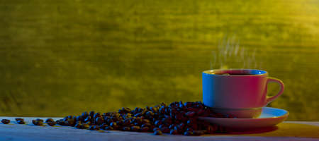 Beans with coffee cup on the table.の写真素材