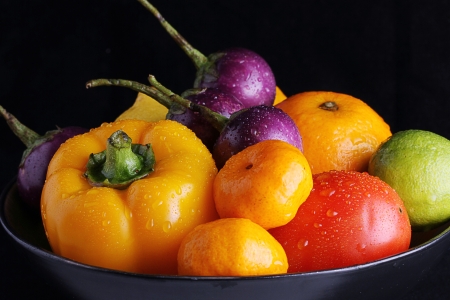 fruits in the bowl, isolated black back groundの写真素材