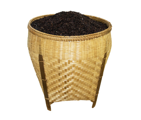 Rice grain in basket isolated on white backgroundの写真素材