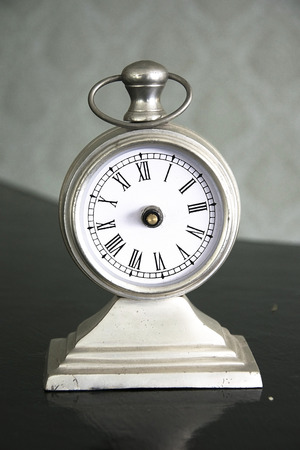 Retro clock on table.