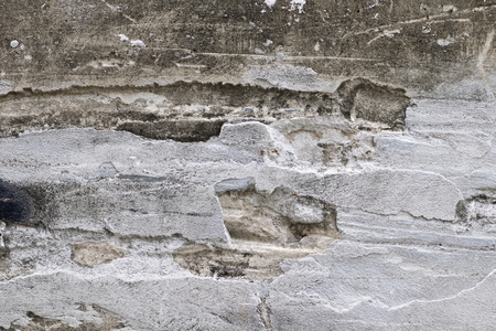 Cracked concrete old brick wall backgroundの写真素材