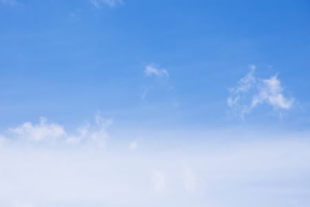 blue sky background with tiny cloudsの写真素材