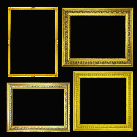 gold picture frame. Isolated on black backgroundの写真素材
