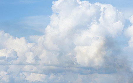 white fluffy clouds in the blue skyの写真素材