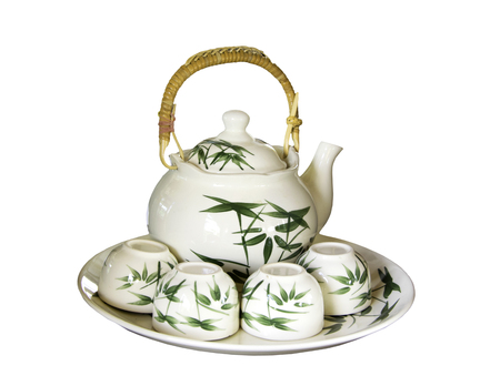 Chinese teapot and teacups on the dish isolated on whiteの写真素材