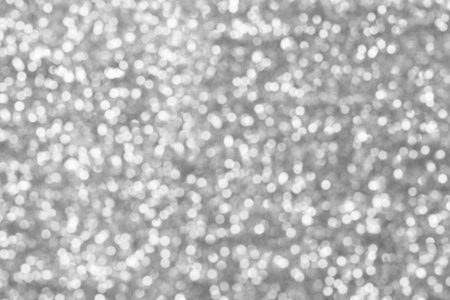 silver bokeh texture. Festive glitter background with defocused lightsの写真素材