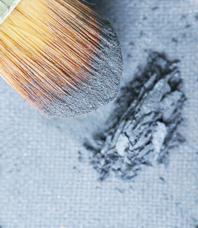 make-up brush on blue crushed eyeshadowの写真素材