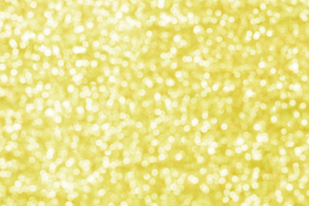 Gold bokeh texture. Festive glitter background with defocused lightsの写真素材