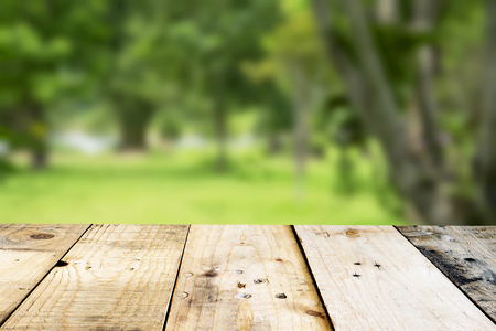 Empty top wooden table and sunny abstract blurred backgroundの写真素材