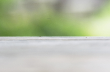 Empty top wooden table and sunny abstract blurred backgroundの写真素材