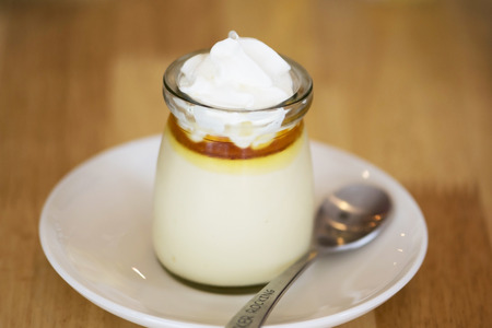 Caramel custard with whipped in glassの写真素材
