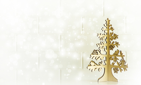 Gold Christmas tree and white wall backgroundの写真素材