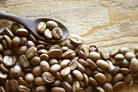 Coffee and wood spoon on grunge wooden backgroundの写真素材