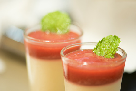 Strawberry mousse and mint leave in glassの写真素材