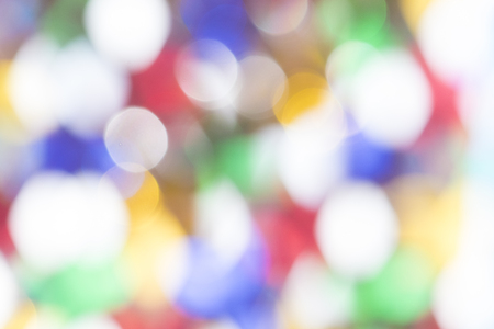 Defocused Bokeh twinkling lights Vintage background. Festive background with natural bokeh and bright lights.の写真素材