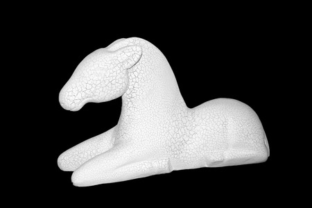 Beautiful sculpture of horse made of plaster isolated on the black backgroundの写真素材