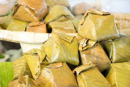 Rice is the food of the northern Thailand. Made from rice mixed with blood wrap
with banana leaf then to steam. Khow kan jin.の写真素材
