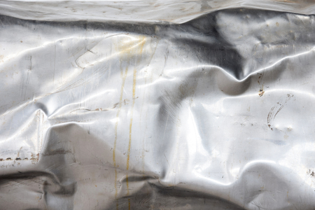 crumpled and scratched metal textureの写真素材