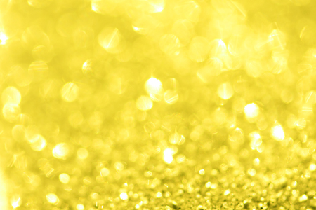 golden background of defocused abstract lights. golden bokeh lights.の写真素材